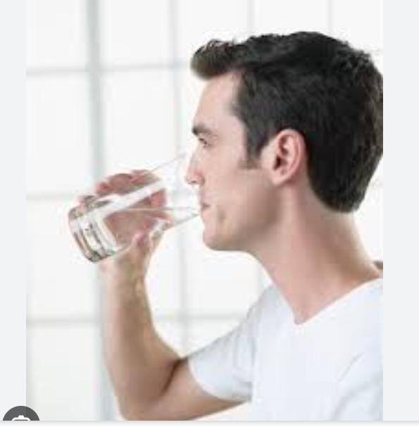 Person drinking a glass of water (पानी का गिलास पीता व्यक्ति)